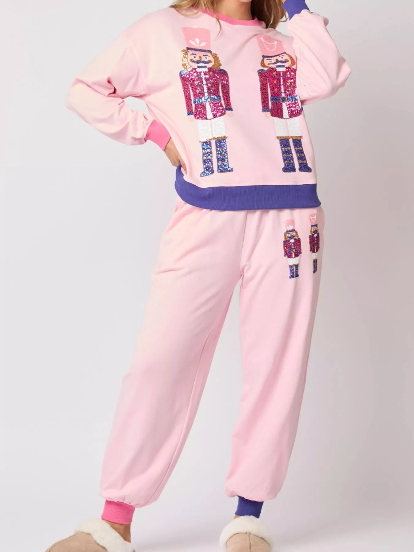 Pink pajama set with robot design on a white background