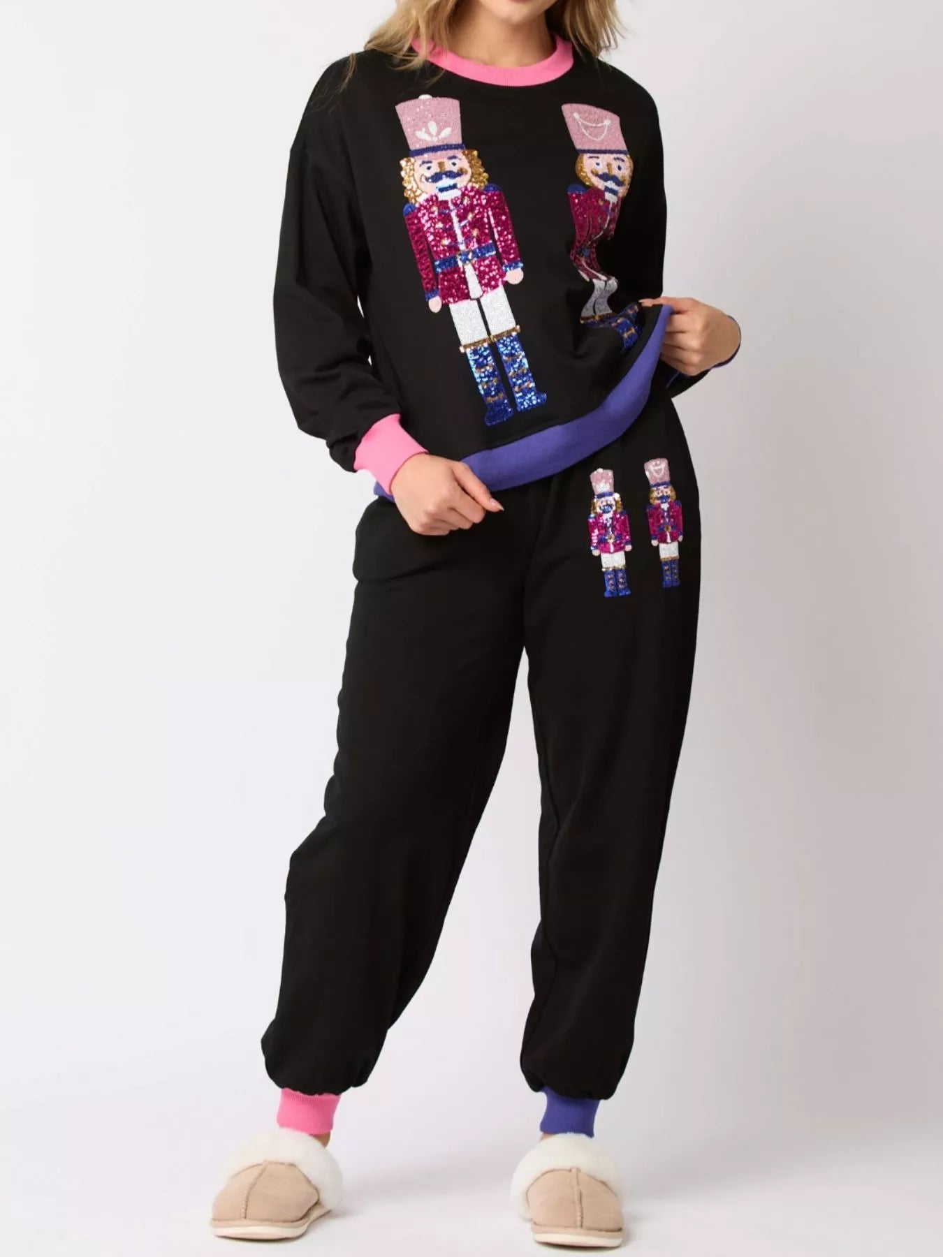 Front view of Nutcracker contrast trim sweatshirt and pants set for women, festive Christmas matching loungewear outfit.