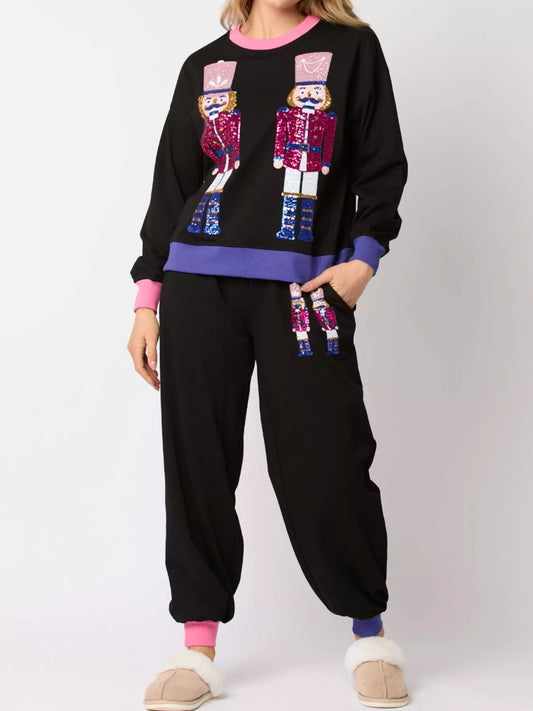Nutcracker contrast trim sweatshirt and pants set for women, festive Christmas loungewear outfit with holiday nutcracker design, cozy matching set perfect for winter and holiday parties.
